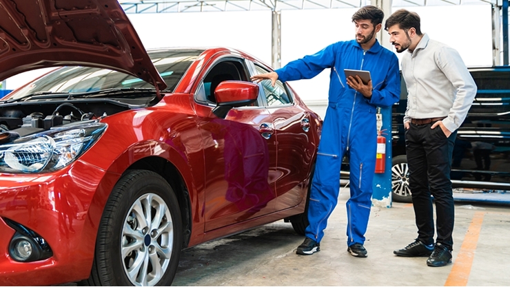 Men discussing a car