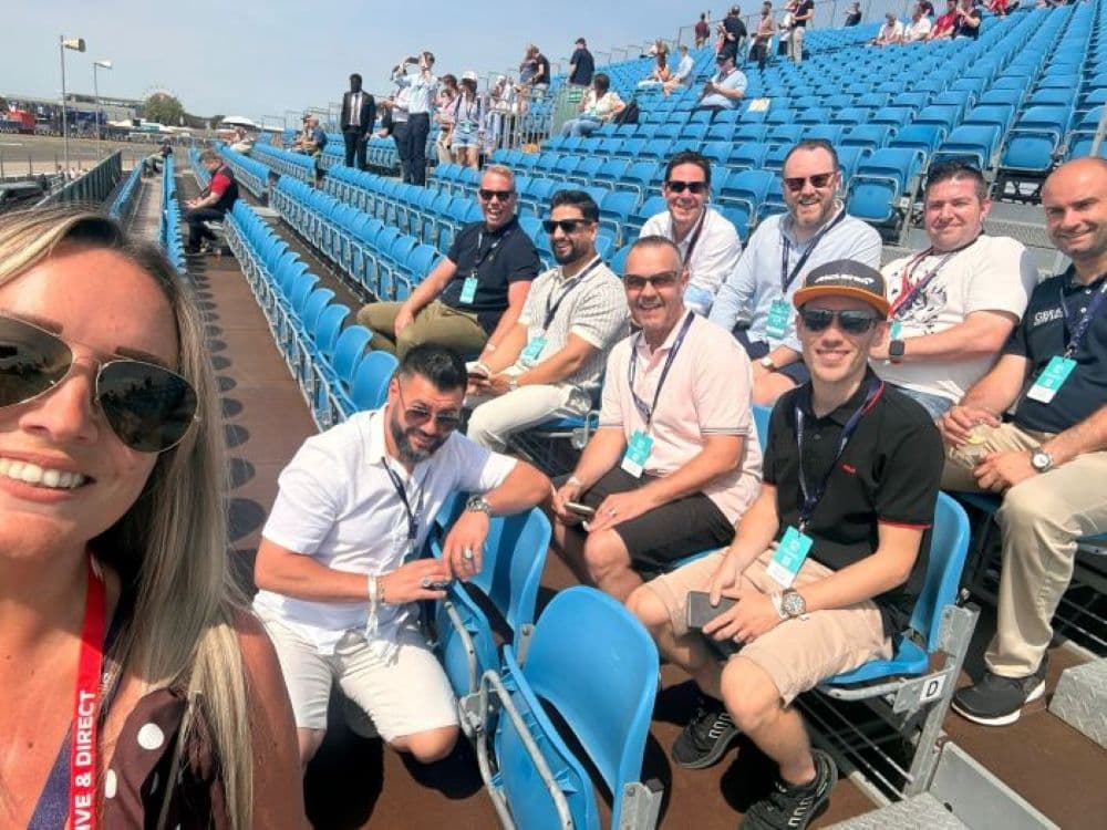 Rochelle Davey, BMG Sales Director, with employees & top independent garage partners at Silverstone